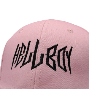 Pink cotton baseball cap featuring black HELLBOY embroidery with a street style aesthetic