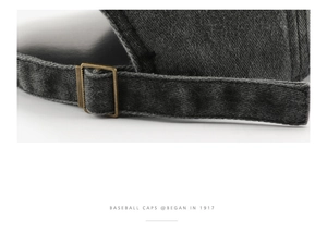 Detail of adjustable metal buckle and washed denim texture on vintage baseball cap