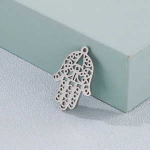 Polished silver stainless steel Hamsa hand pendant with intricate hollow pattern