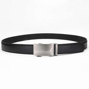Detail of black leather belt strap with brushed metal automatic buckle and fine stitching