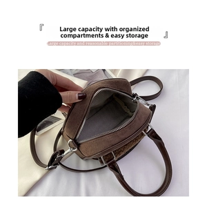 Interior view of brown plush crossbody bag showing large capacity and wavy grey lining