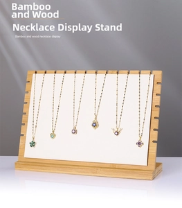 Bamboo necklace display stand with white padded board showing six jewelry pendants