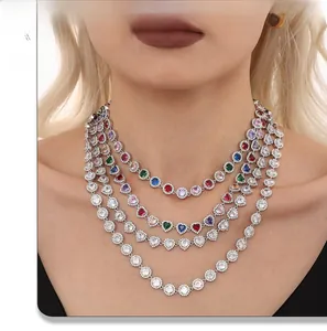 Close-up of layered necklace set featuring multicolored heart-shaped zircon stones