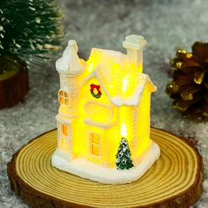 Luminous Christmas Toy Shop house miniature with LED warm lights and snow detail