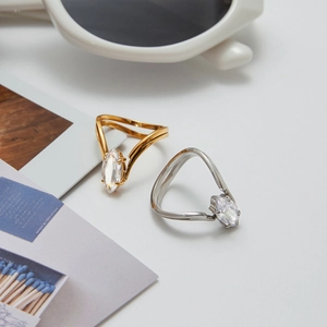 18K gold and silver stainless steel open rings with marquise zircon stones in a flat lay