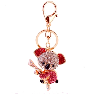 Golden koala keychain with clear and red crystals and secure lobster clasp on white background
