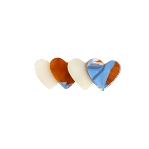 Elegant acetate heart-shaped hair clip with beige and amber marble patterns
