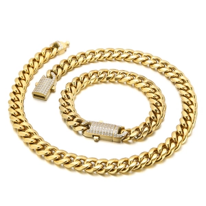 Hip hop style gold Cuban link chain set with sparkling CNC iced out buckle detail