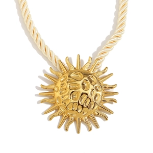 Chunky cream rope necklace with oversized hammered 18K gold plated sun pendant