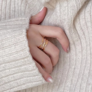 Elegant 925 silver multi-layer gold wavy crossover ring shown on model hand