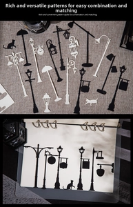 Detailed view of vintage street lamp and cat silhouette lace paper for DIY scrapbooking