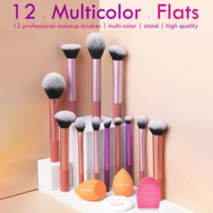 Close-up of 12 professional makeup brushes with pink handles on a white display stand