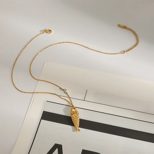 Golden titanium steel O-chain necklace featuring a textured fish pendant with black eye