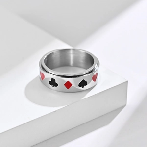 Stainless steel spinner ring featuring black and red poker suit patterns on silver band