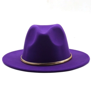 Detail view of purple wool fedora hat with gold snake chain trim on white background