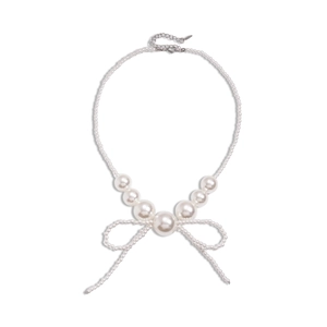 Elegant pearl bead necklace with bow pendant and tassels on a clean white background