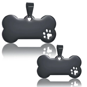 Two black bone-shaped stainless steel dog tags with hollow paw prints on white background