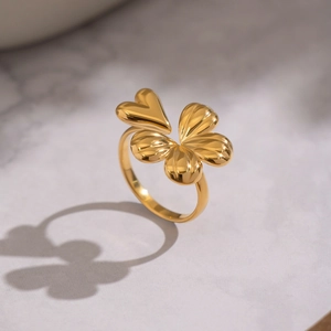 Creative gold adjustable clover ring with heart shaped textured and smooth petals