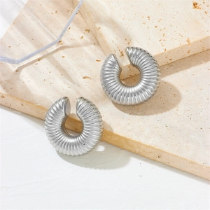 Polished silver stainless steel hollow ear cuffs with textured thread design on stone