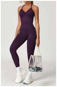 Detail of plum seamless yoga vest showing ribbed texture and cross halter neckline style
