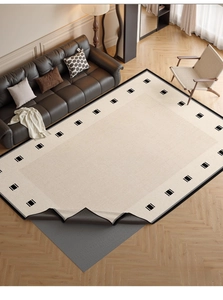 Close-up of washable chenille rug showing black geometric borders and anti-slip back