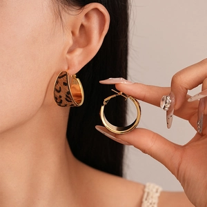 Detail of leopard print flocking on C-shape gold earrings with S925 silver needle