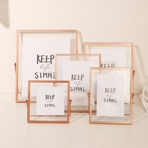 Minimalist rose gold metal photo frames in multiple sizes for elegant desk display