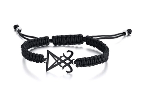 Detail of black woven rope bracelet with metallic Sigil of Lucifer charm and adjustable knot