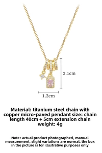 Macro detail of titanium steel necklace with crystal pavé rings and pink gemstone pendant