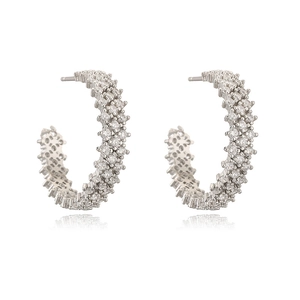 Elegant C-shaped silver earrings with sparkling cubic zirconia on white background