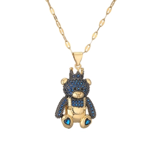 Elegant gold titanium steel necklace featuring a crown bear pendant with blue crystals