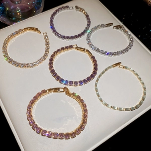 Close-up of geometric cubic zirconia tennis bracelets with various colorful gemstones
