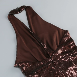 Close-up of bronze sequin halter neck with button closure and smooth satin lining