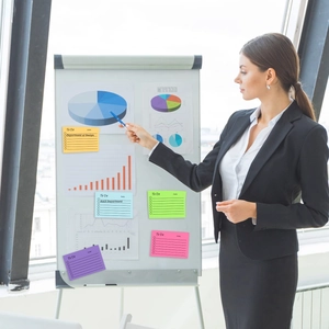 Business professional using colorful To Do list sticky notes for workplace planning and tasks