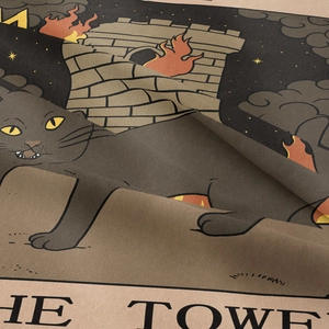 Macro shot showing woven texture of Bohemian cat tarot tapestry with The Tower illustration