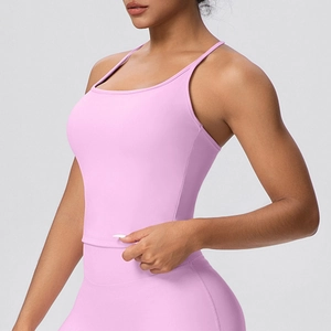 Close-up of bright pink seamless sports bra and high-waisted leggings on a model
