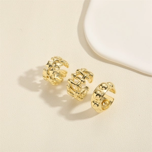 Three-piece gold metal jewelry set with star cutouts, woven texture, and beaded bands