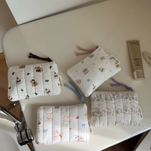 Detailed set of quilted cotton cosmetic bags with cute animal patterns and zipper pulls
