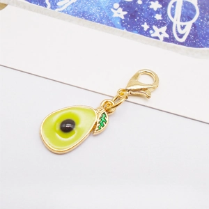 Detailed view of an avocado enamel pendant with a gold clasp and a green leaf detail