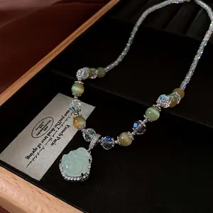 Zircon Buddha pendant necklace with crystal beads and cat eye stones in jewelry box
