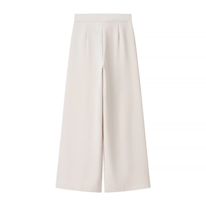 Detailed view of cream-white wide-leg trousers with elegant drape and high-waist design