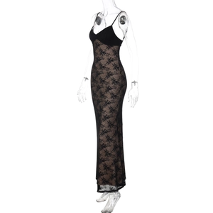 Detail of elegant black lace maxi dress with nude lining and slim camisole straps