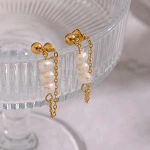 Elegant gold drop earrings featuring three natural freshwater pearls on a delicate long chain
