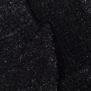 Makroaufnahme von schwarzem Tweed-Stoff mit metallischen Silberfäden und Glitzereffekt