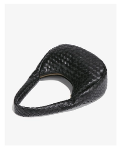 Close-up of black woven leather hobo bag with gold zipper detail and fine texture