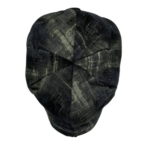 Top view of vintage tie-dye slouchy beanie with six-panel stitching and rugged texture