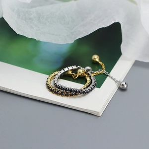 Detail of adjustable S925 silver rings with black stones and drawstring chain link