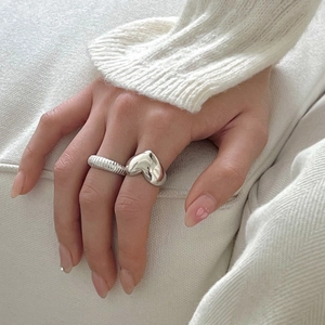 Minimalist 925 sterling silver heart ring and twisted band stacked on finger