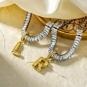 Elegant gold zircon letter L and R pendant necklaces on rectangular stone chains