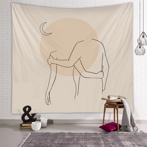 Close-up of minimalist line art tapestry on white brick wall with artistic home decor